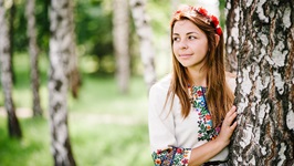 Lady in Embroidered Top by Tree